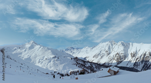 Morning winter Silvretta Alps landscape. Ski resort, Tyrol, Austria. All skiers are unrecognizable.