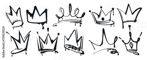 Set of graffiti spray painted crowns. Black brush paint king crown isolated on white background. Hand drawn street art vector illustration. Grunge airbrush drawing, inky elements with splashes. photo