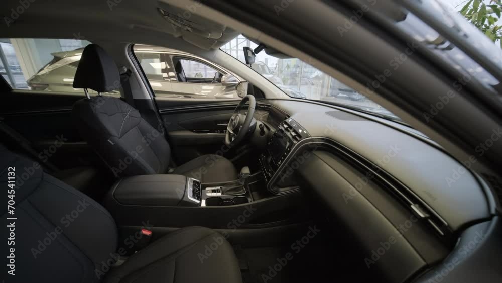 Car dealership with row of anonymous new vehicle on sale. Showroom with shiny auto. Automotive Car dealership with row of anonymous new vehicle on sale. Showroom with shiny auto. Automotive