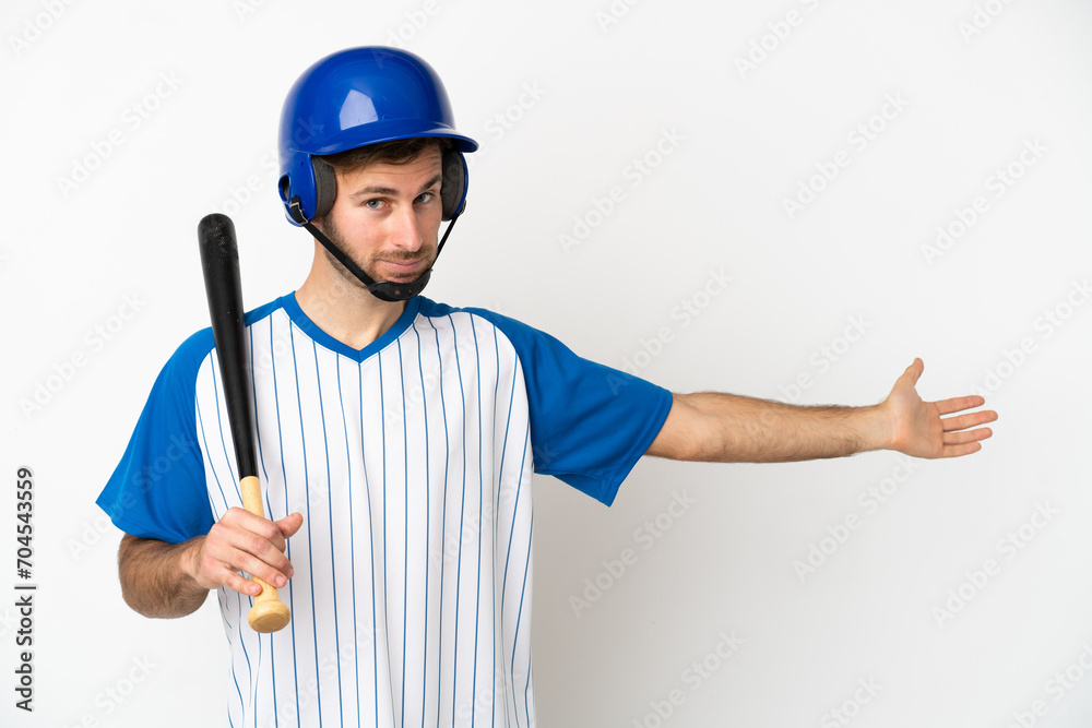 Young caucasian man playing baseball isolated on white background extending hands to the side for inviting to come Young caucasian man playing baseball isolated on white background extending hands to the side for inviting to come