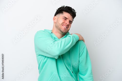 Young caucasian man isolated on white background suffering from pain in shoulder for having made an effort © luismolinero