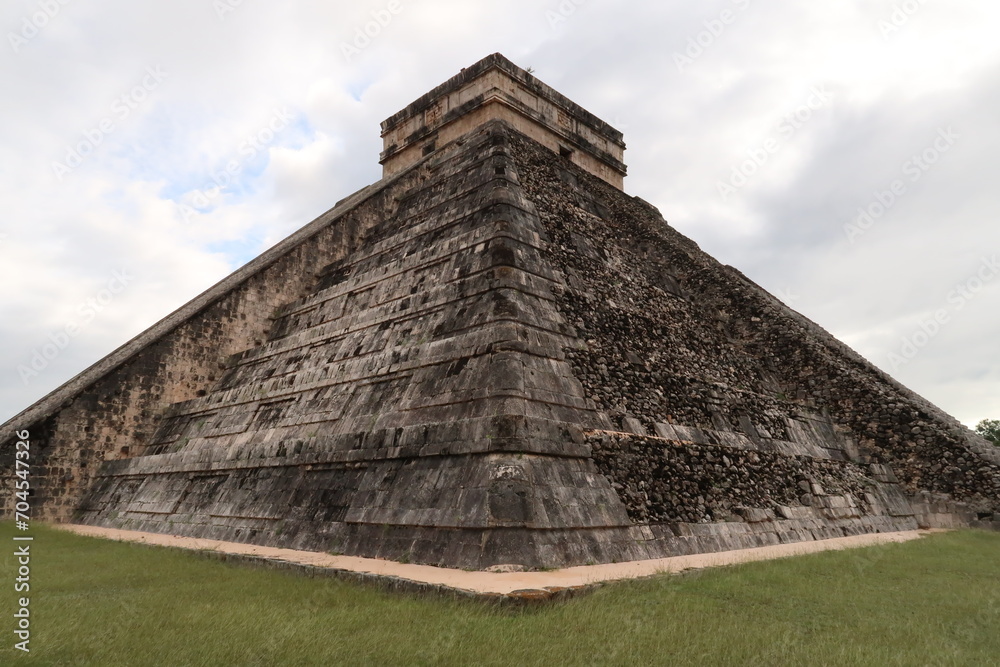 Pyramid of Kukulcan, El Castillo, The Castle, at Chichen Itza, one side is restored the other still destroyed, Valladolid, Mexico