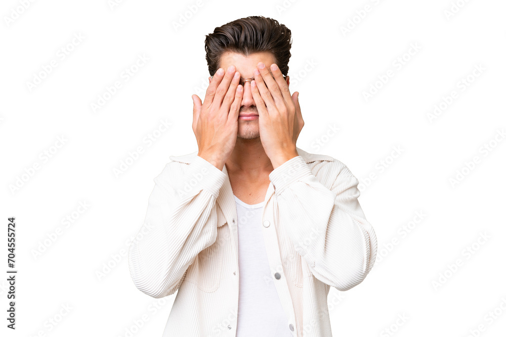 Young handsome caucasian man over isolated background covering eyes by hands Young handsome caucasian man over isolated background covering eyes by hands