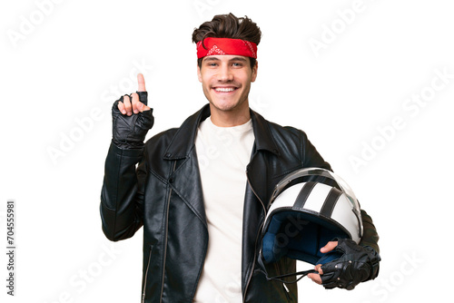 Young caucasian man with a motorcycle helmet over isolated background pointing up a great idea