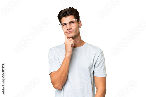 Young caucasian handsome man over isolated background and thinking