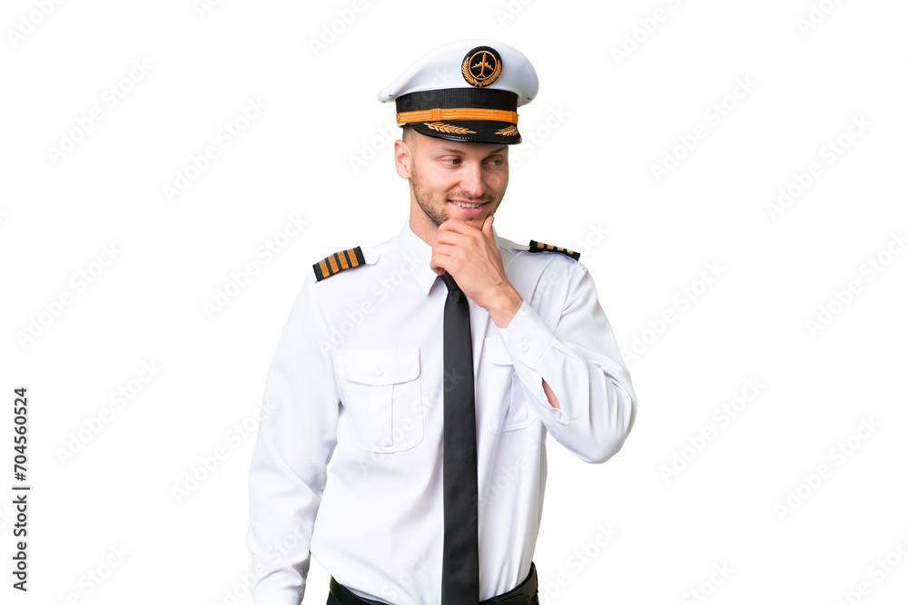 Airplane pilot man over isolated background looking to the side Airplane pilot man over isolated background looking to the side