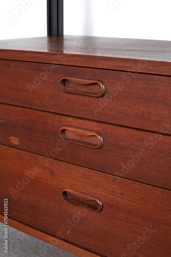  Vintage walnut and black steel wall unit. Iconic 1960s floating cabinets on a steel frame design. Close-up detail photograph.
 photo