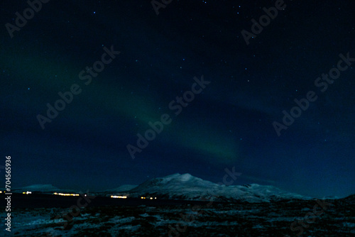 northern light in scandinavian norway near tromso  photo