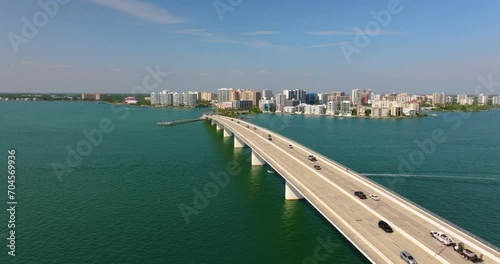 Wallpaper Mural Above view of Sarasota city, Florida with waterfront office high-rise buildings and John Ringling Causeway leading from downtown to St. Armands Key. Development of housing and transportation in the US Torontodigital.ca