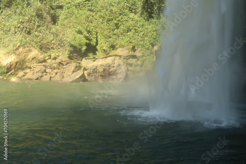 Close up on the Misol-Ha Waterfall/Cascada de Misol-Ha falling into the lagoon, close to Palenque, Mexico