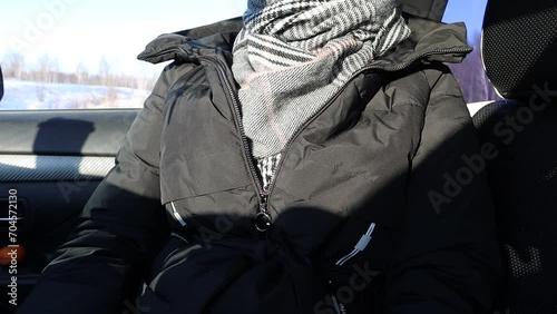 The girl shows a gesture with her hand - the symbol of a goat. The little finger and index finger are put forward.