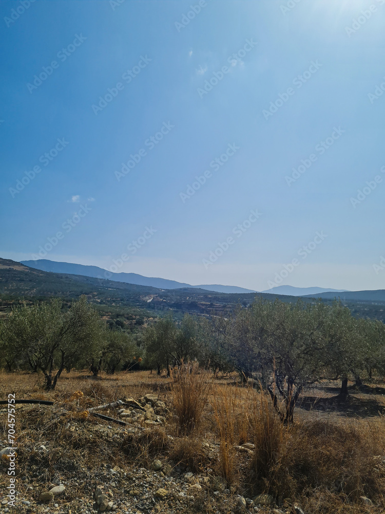 Greece island many hills with blue sky and white clouds