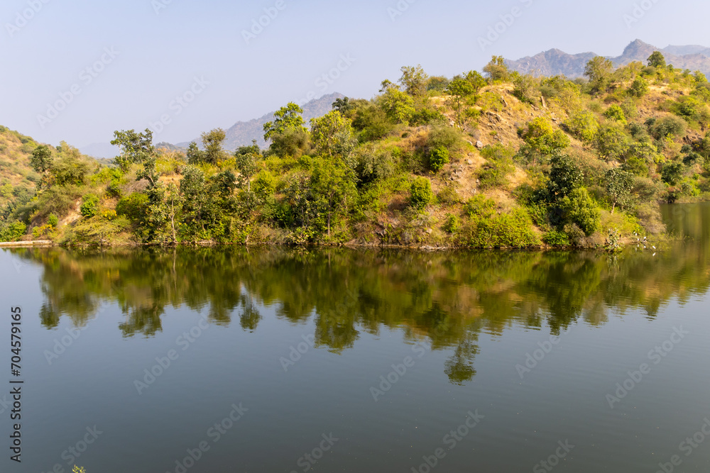 mountain forest with pristine lake reflection at day from different angle