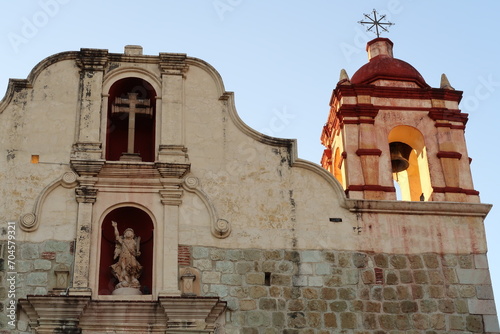 Facade of the church Iglesia Preciosa Sangre de Cristo with its beautiful bell tower and ornaments, Oaxaca, Mexico photo