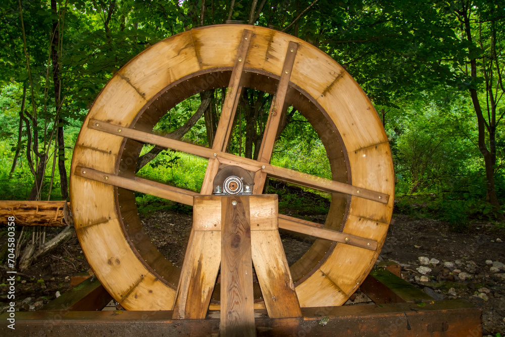 Rotating water wheel in the forest near Muran