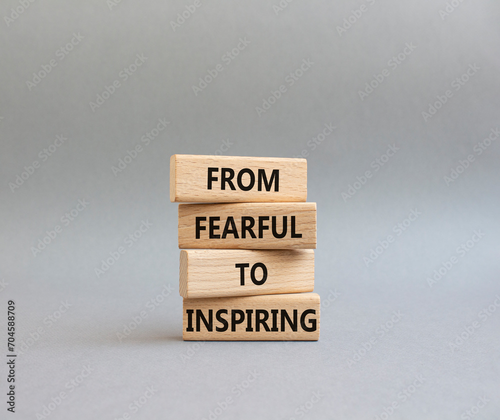 From Fearful to Inspiring symbol. Concept words From Fearful to Inspiring on wooden blocks. Beautiful grey background. Business and From Fearful to Inspiring concept. Copy space. From Fearful to Inspiring symbol. Concept words From Fearful to Inspiring on wooden blocks. Beautiful grey background. Business and From Fearful to Inspiring concept. Copy space.
