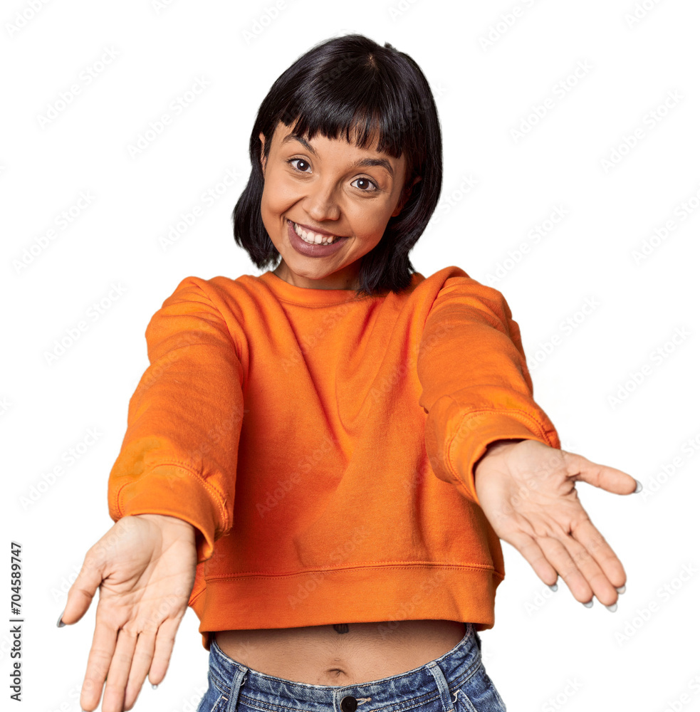 Young Hispanic woman with short black hair in studio showing a welcome expression. Young Hispanic woman with short black hair in studio showing a welcome expression.