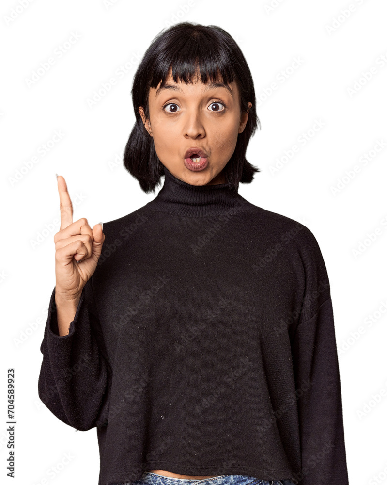 Young Hispanic woman with short black hair in studio having an idea, inspiration concept. Young Hispanic woman with short black hair in studio having an idea, inspiration concept.