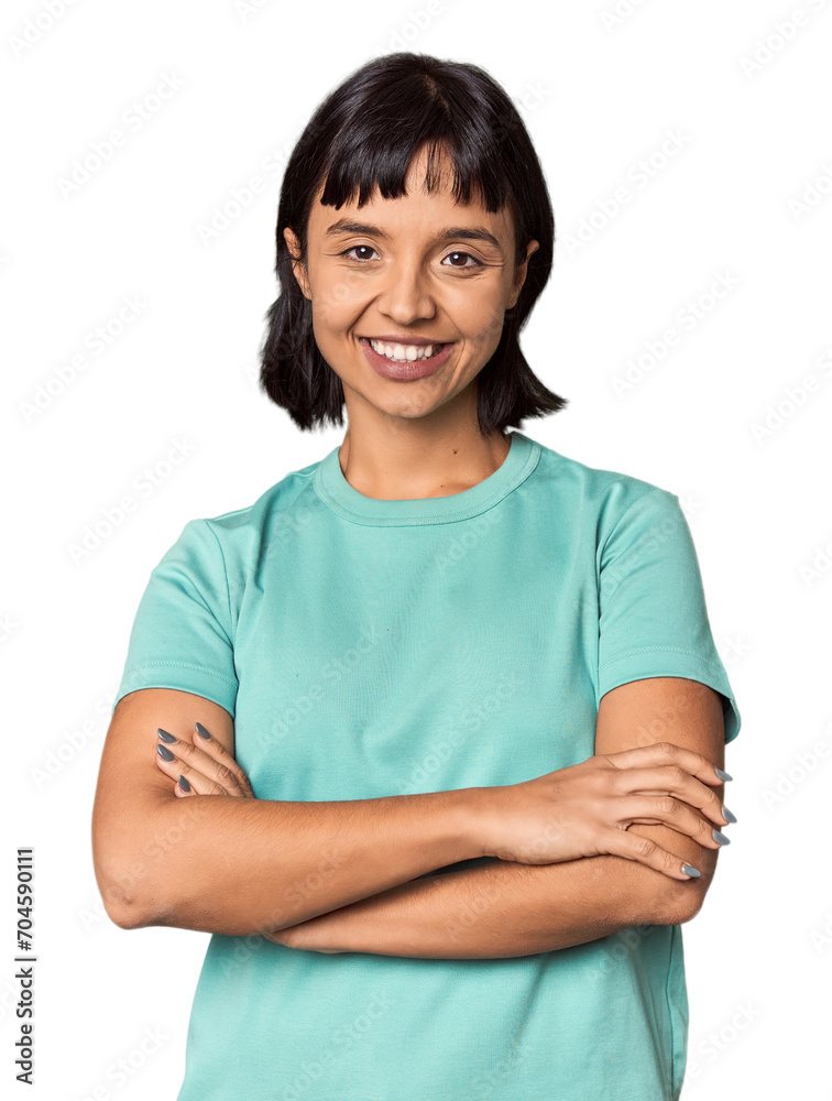 Young Hispanic woman with short black hair in studio who feels confident, crossing arms with determination. Young Hispanic woman with short black hair in studio who feels confident, crossing arms with determination.