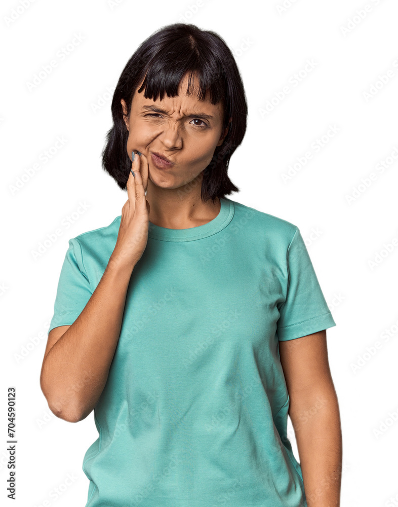 Young Hispanic woman with short black hair in studio having a strong teeth pain, molar ache. Young Hispanic woman with short black hair in studio having a strong teeth pain, molar ache.