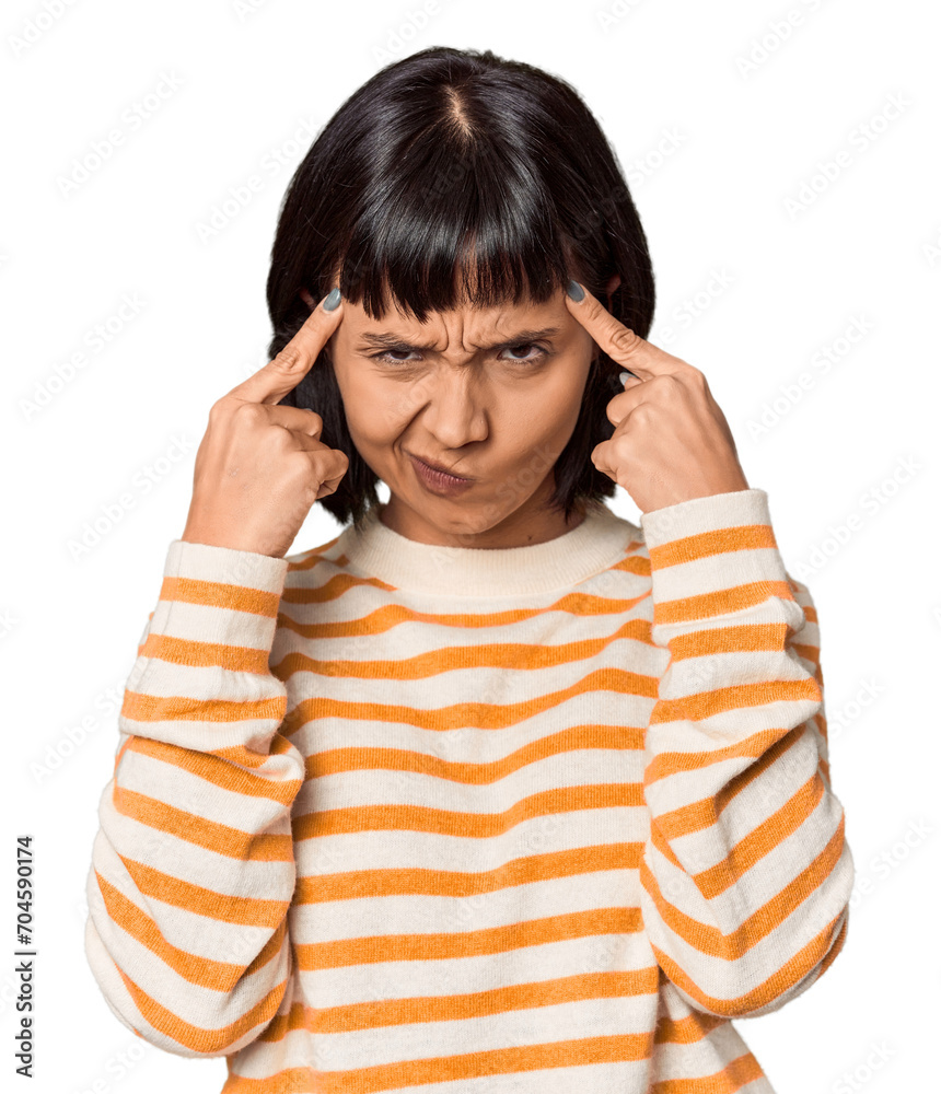 Young Hispanic woman with short black hair in studio focused on a task, keeping forefingers pointing head. Young Hispanic woman with short black hair in studio focused on a task, keeping forefingers pointing head.
