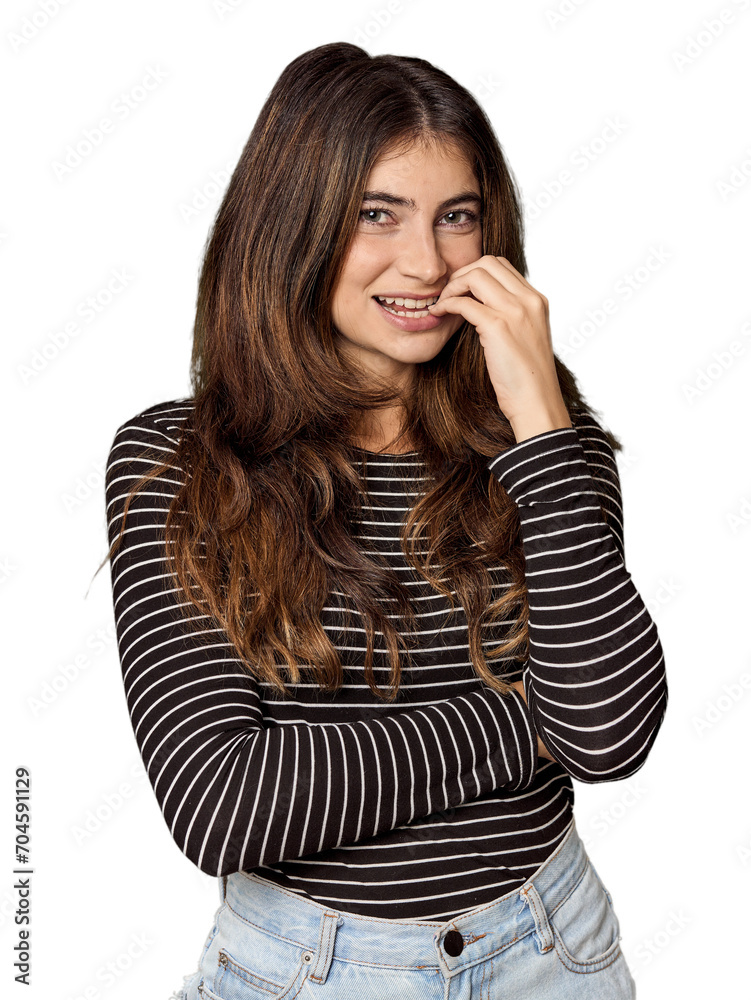 Young Caucasian woman in studio setting biting fingernails, nervous and very anxious. Young Caucasian woman in studio setting biting fingernails, nervous and very anxious.