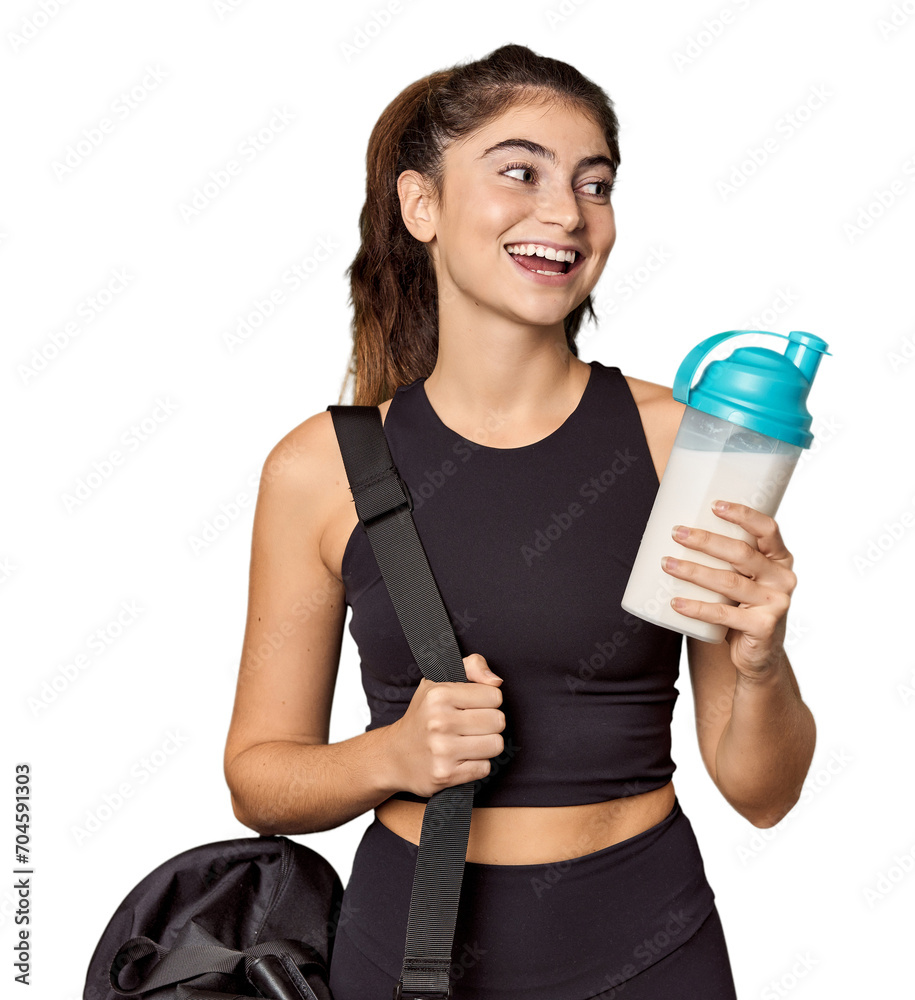 Caucasian athlete with gym bag & protein shake in studio Caucasian athlete with gym bag & protein shake in studio