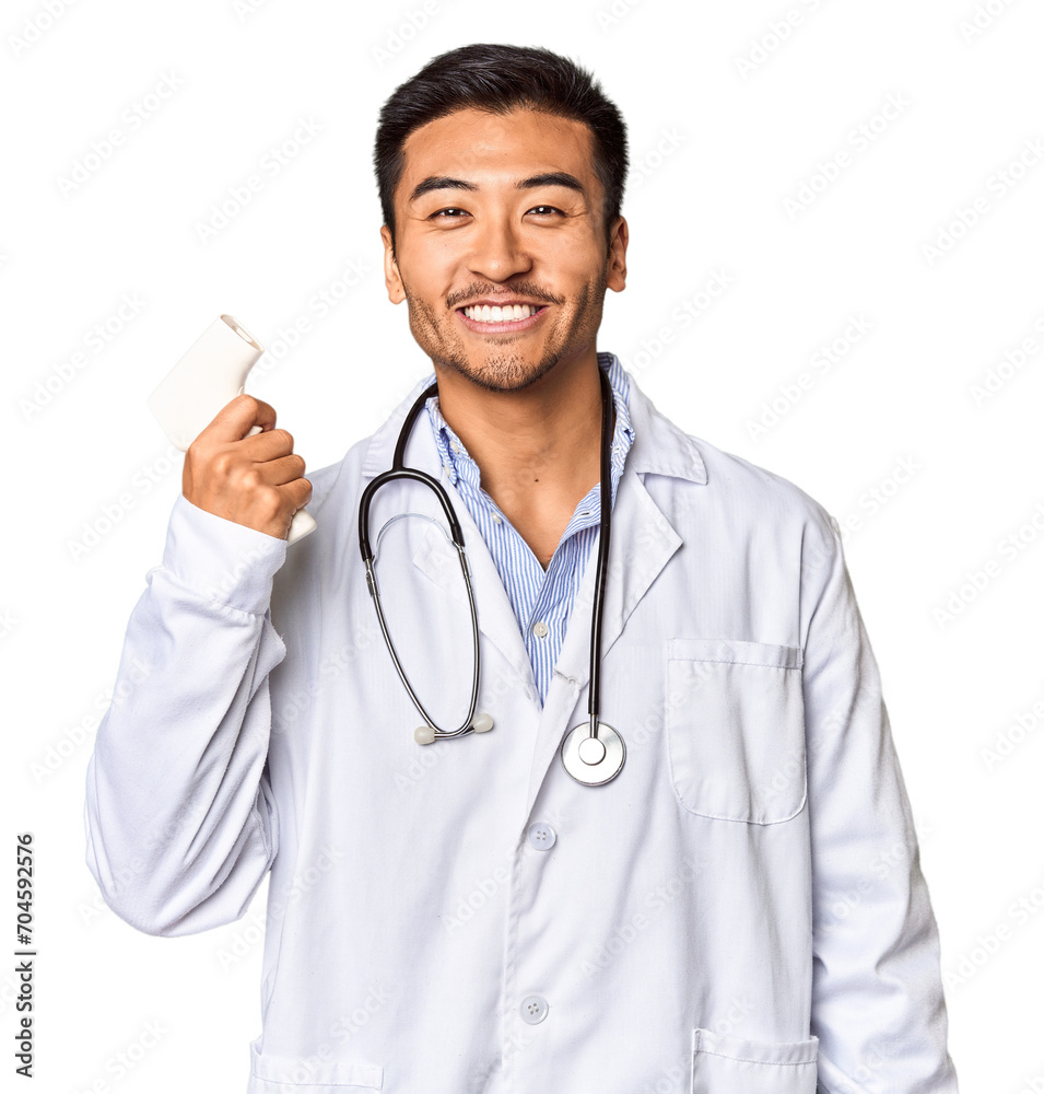 Chinese male doctor holding a temperature meter in studio Chinese male doctor holding a temperature meter in studio