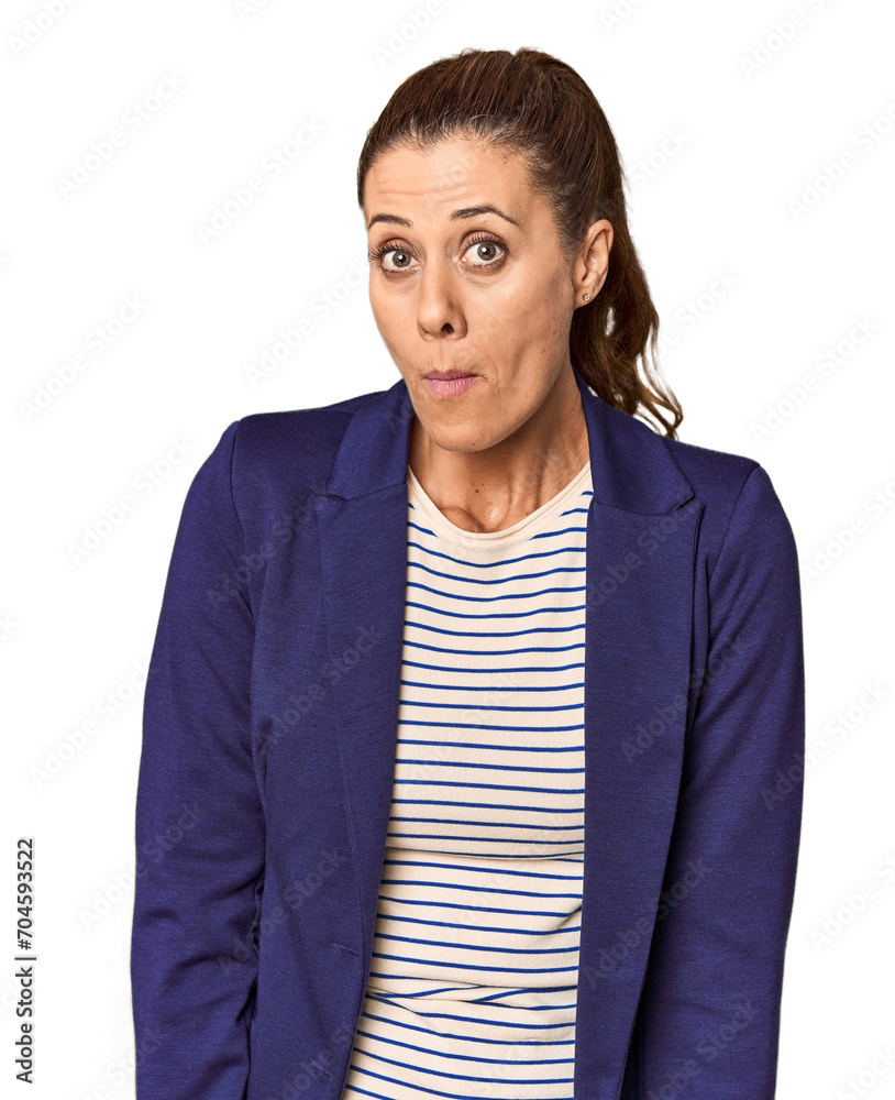 Middle-aged female entrepreneur in studio shrugs shoulders and open eyes confused. Middle-aged female entrepreneur in studio shrugs shoulders and open eyes confused.