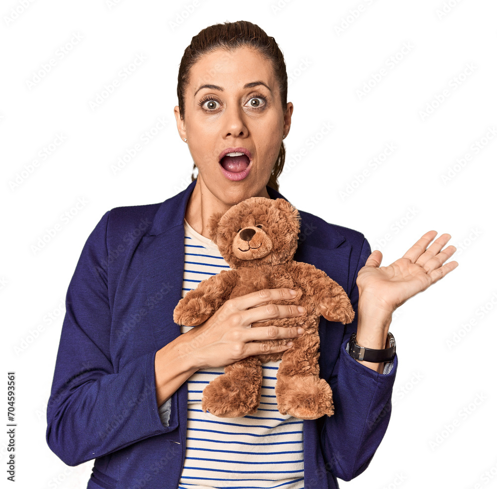 Entrepreneur with plush toy, toy industry theme surprised and shocked. Entrepreneur with plush toy, toy industry theme surprised and shocked.