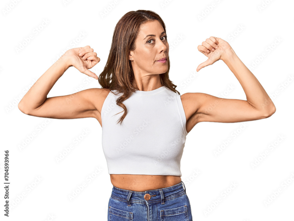 Middle-aged woman portrait in studio setting feels proud and self confident, example to follow. Middle-aged woman portrait in studio setting feels proud and self confident, example to follow.