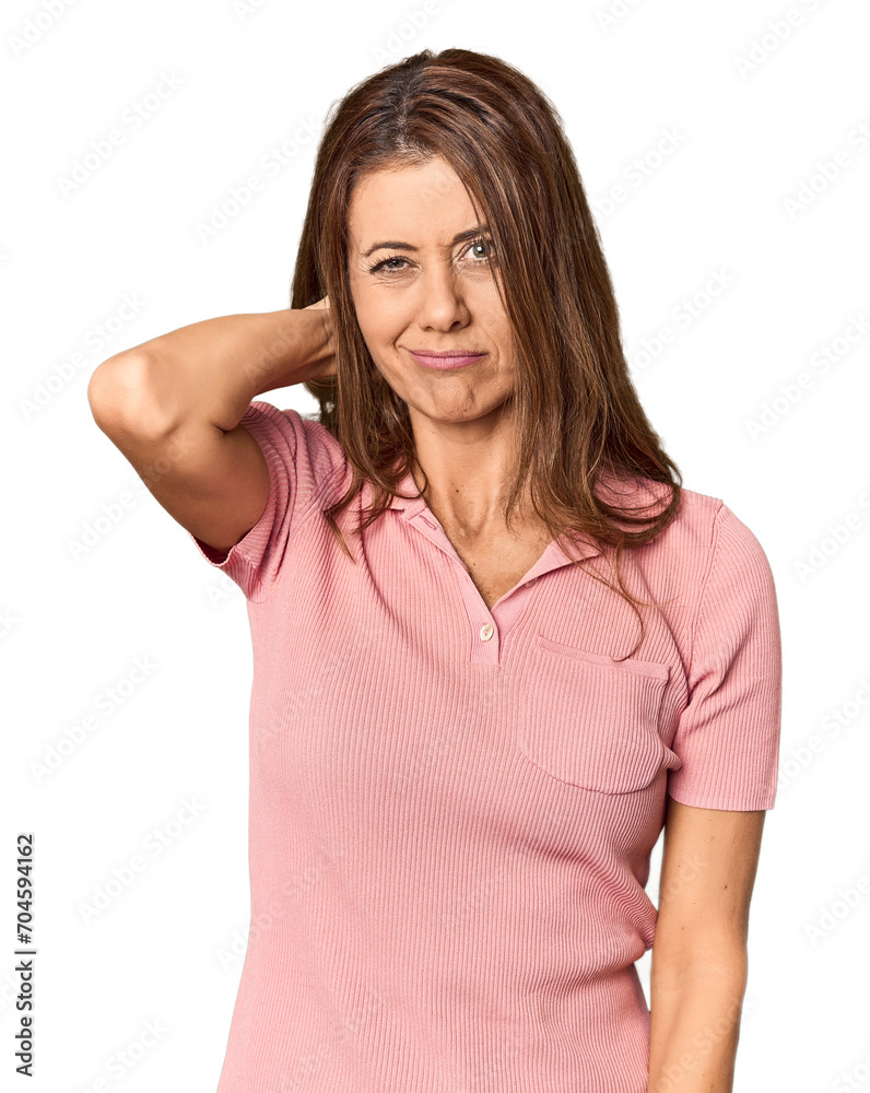 Middle-aged woman portrait in studio setting having a neck pain due to stress, massaging and touching it with hand. Middle-aged woman portrait in studio setting having a neck pain due to stress, massaging and touching it with hand.