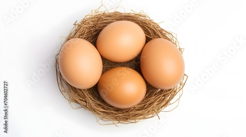 Top View of light brown Eggs in a Nest on a white Background. Easter Template with Copy Space