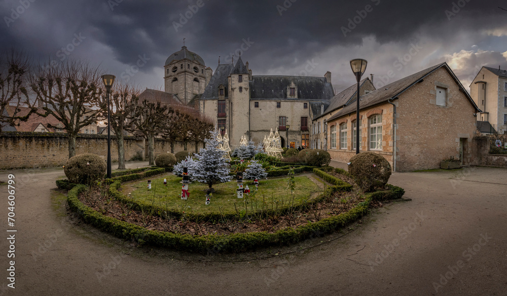 Alençon, France - 12 27 2023:  The garden of the House of Ozé and the Basilica of Our Lady at Christmas.
