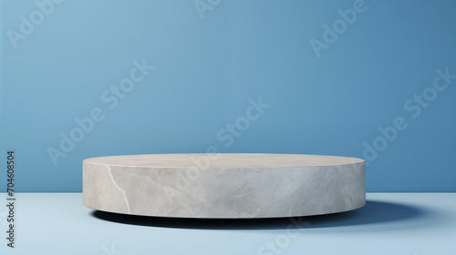solitary thin stone product podium against a seamless blue background