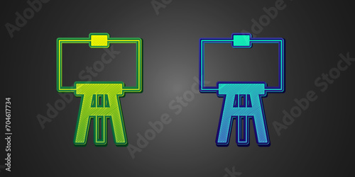 Green and blue Wood easel or painting art boards icon isolated on black background. Vector