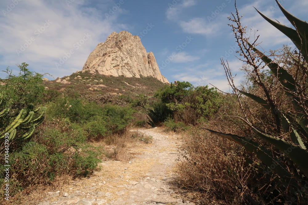 Fototapeta premium Hiking up to the famous Pena de Bernal, a famous monolith of massive rock in San Sebastian Bernal, Queretaro, Mexico