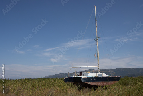 Field with an abandoned yacht, Roda, Corfu