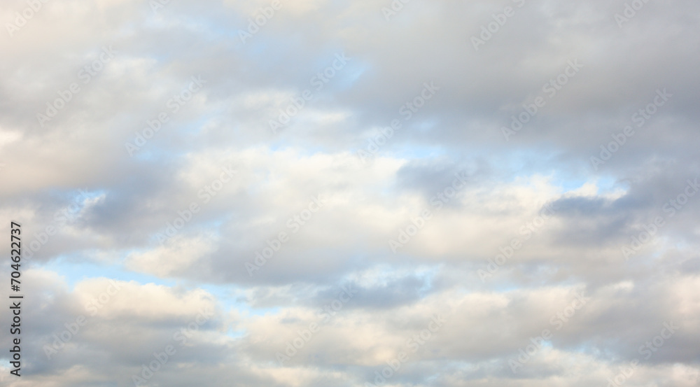 sky filled with fluffy clouds, symbolizing serenity and freedom