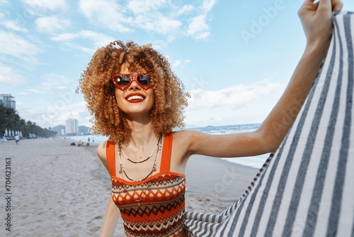 Smiling Woman Enjoying a Carefree Summer Vacation at the Beach