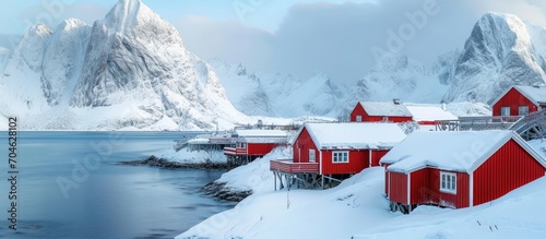 Photographed in winter, traditional Norwegian fisherman's cabins on Hamnoy island in Reine, Lofoten, Norway. photo