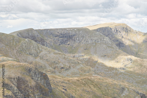 The craggy summits of Helvellyn, Dollywaggon Pike and Nethermost Pike seen from the summit of Fairfield, Lake District, UK