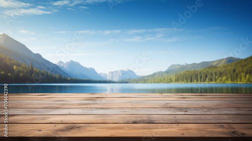 Empty wooden table with blurred nature background, forest and lake landscape, fjord, backdrop, product display template, business and product presentation, rustic wood table © GrafitiRex