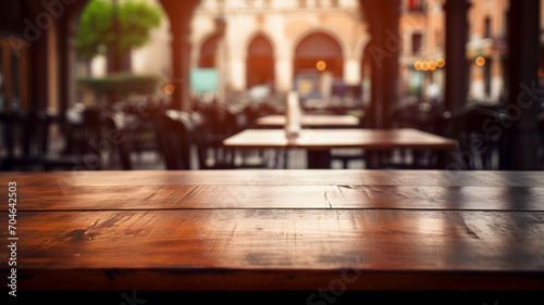 Empty wooden table, outdoor restaurant and cafe, ready for packshot of food, table and street background