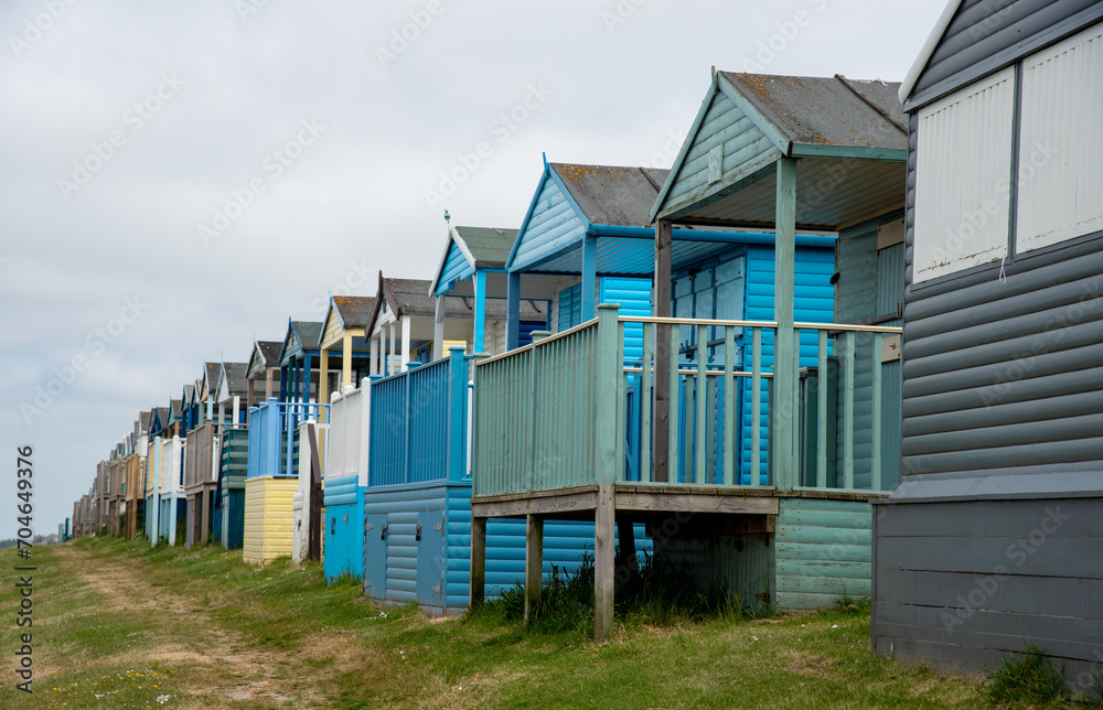 Colorful holiday beach huts. Vacations coastal wooden houses Colorful holiday beach huts. Vacations coastal wooden houses