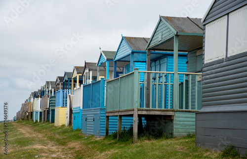 Colorful holiday beach huts. Vacations coastal wooden houses