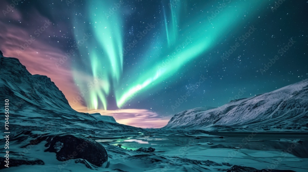  a green and purple aurora bore is in the sky above a mountain and a body of water in the foreground.