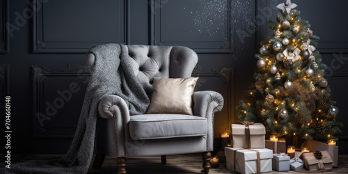 Gray-colored  stylish Christmas interior adorned with fabric-upholstered armchair creates a cozy  comfortable home.