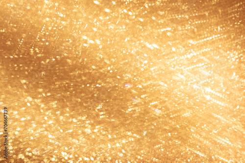 Blurred golden glitter wavy texture background