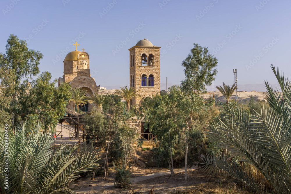 The Greek Orthodox church on the Jordanian side of Jordan river is seen from Palestine at Qasr al-Yahud, West Bank (close to Jesus Christ Baptismal Site).